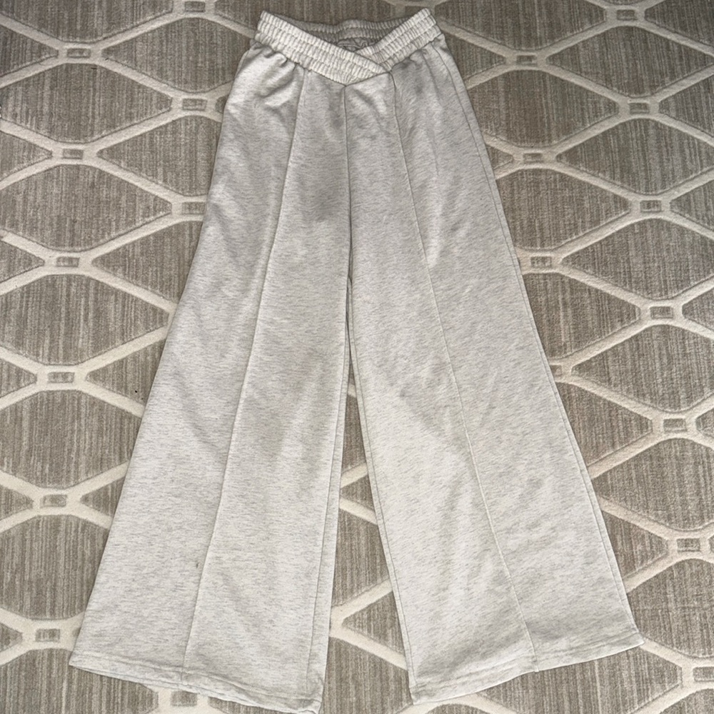 These are brand new, wide leg sweatpants. True to size fit.